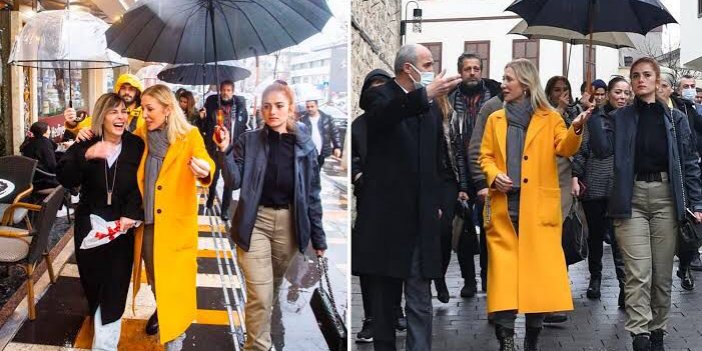 Kültür ve Turizm Bakanı'nın eşi Pervin Ersoy, polis memuruna şemsiye tutturup çantasını taşıttı