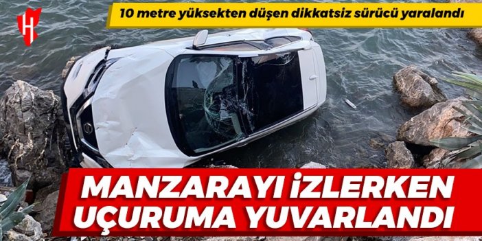 Manzarayı seyrederken otomobiliyle uçuruma yuvarlandı: 1 kişi yaralandı