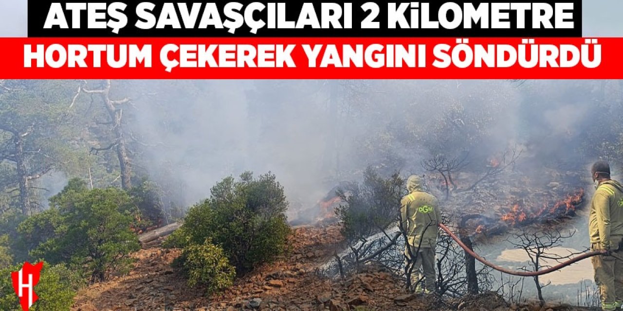 Ateş savaşçıları 2 kilometre hortum çekerek yangını söndürdü