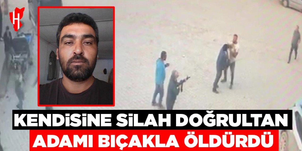 Kendisine silah doğrultan adamı bıçakla öldürdü