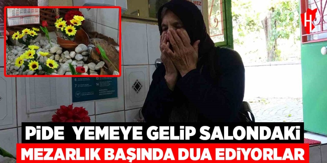 Pide yemeye gelip salondaki mezarlık başında dua ediyorlar