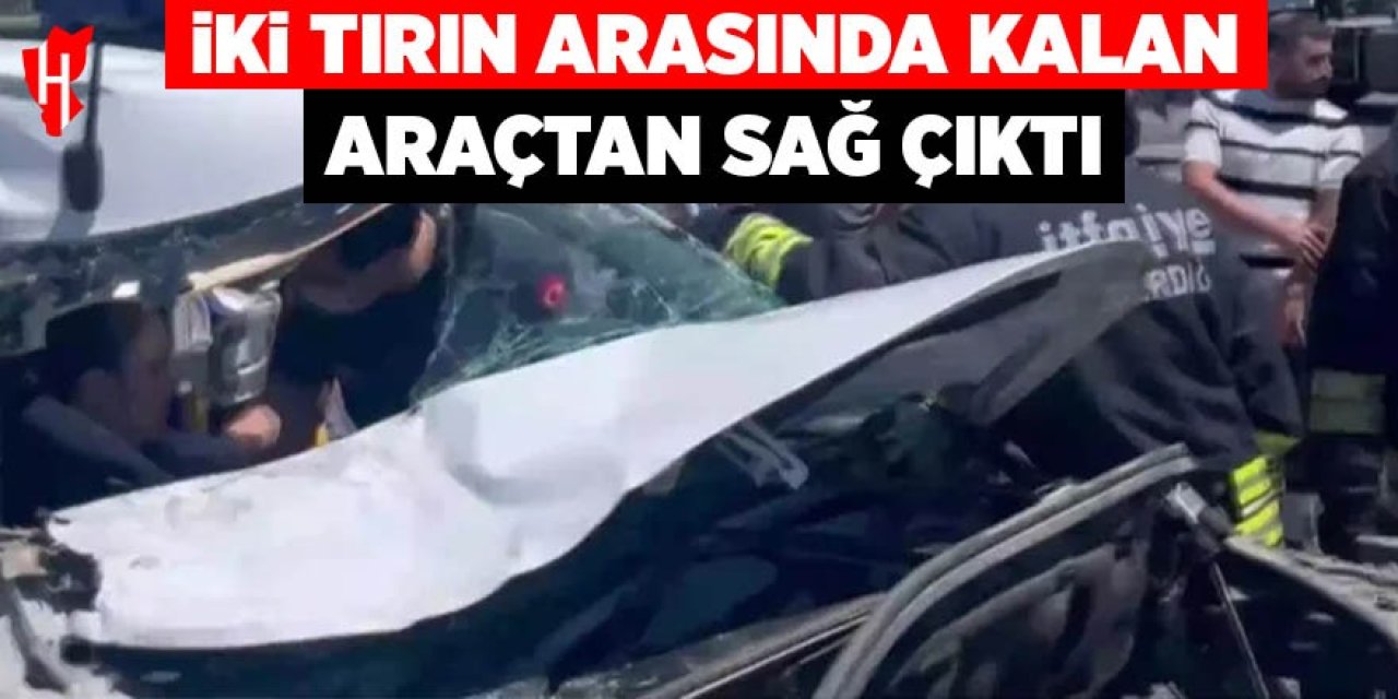 İki tırın arasında kalan araçtan sağ çıktı