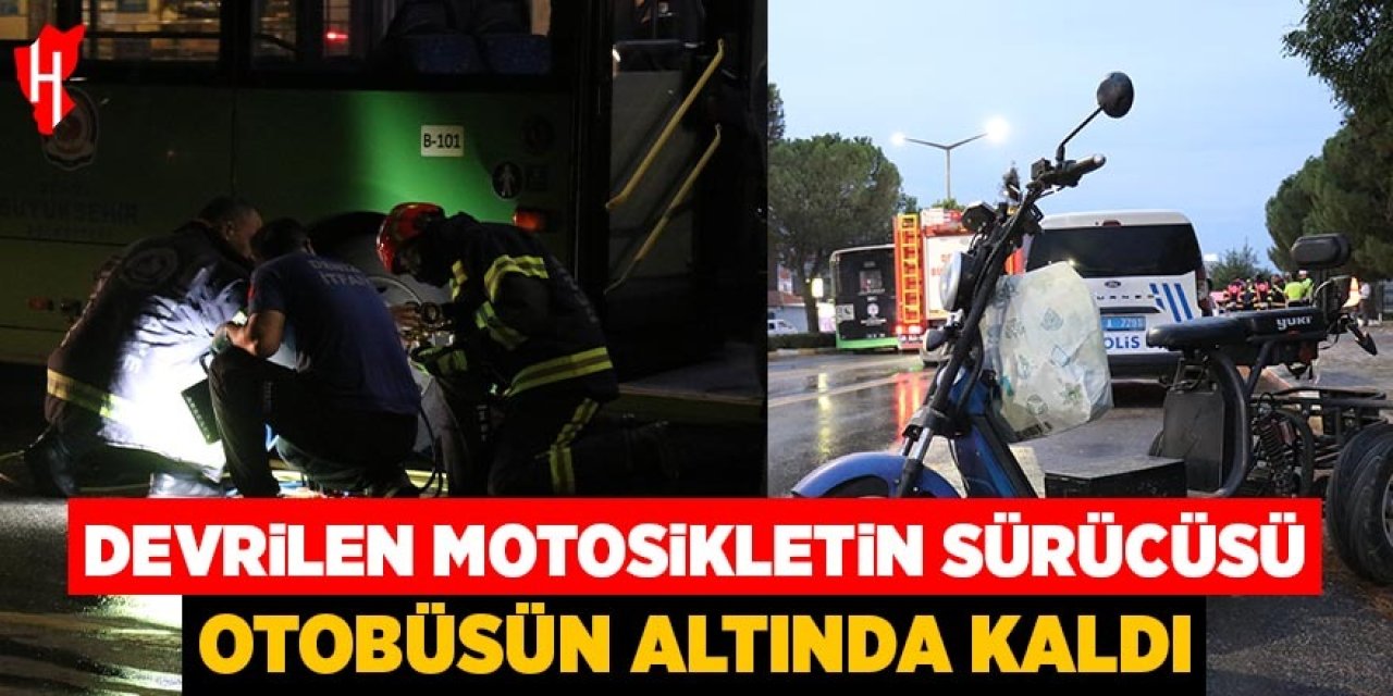 Devrilen motosikletin sürücüsü otobüsün altında kaldı
